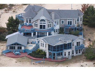 Oceanfront Majestic Compound on 3 Elevated Acres. Sunnybank is an Oceanfront Majestic Compound on 3 Elevated Acres located in the Northern 4 wheel drive section of the OBX in the Corolla/Carova area. 